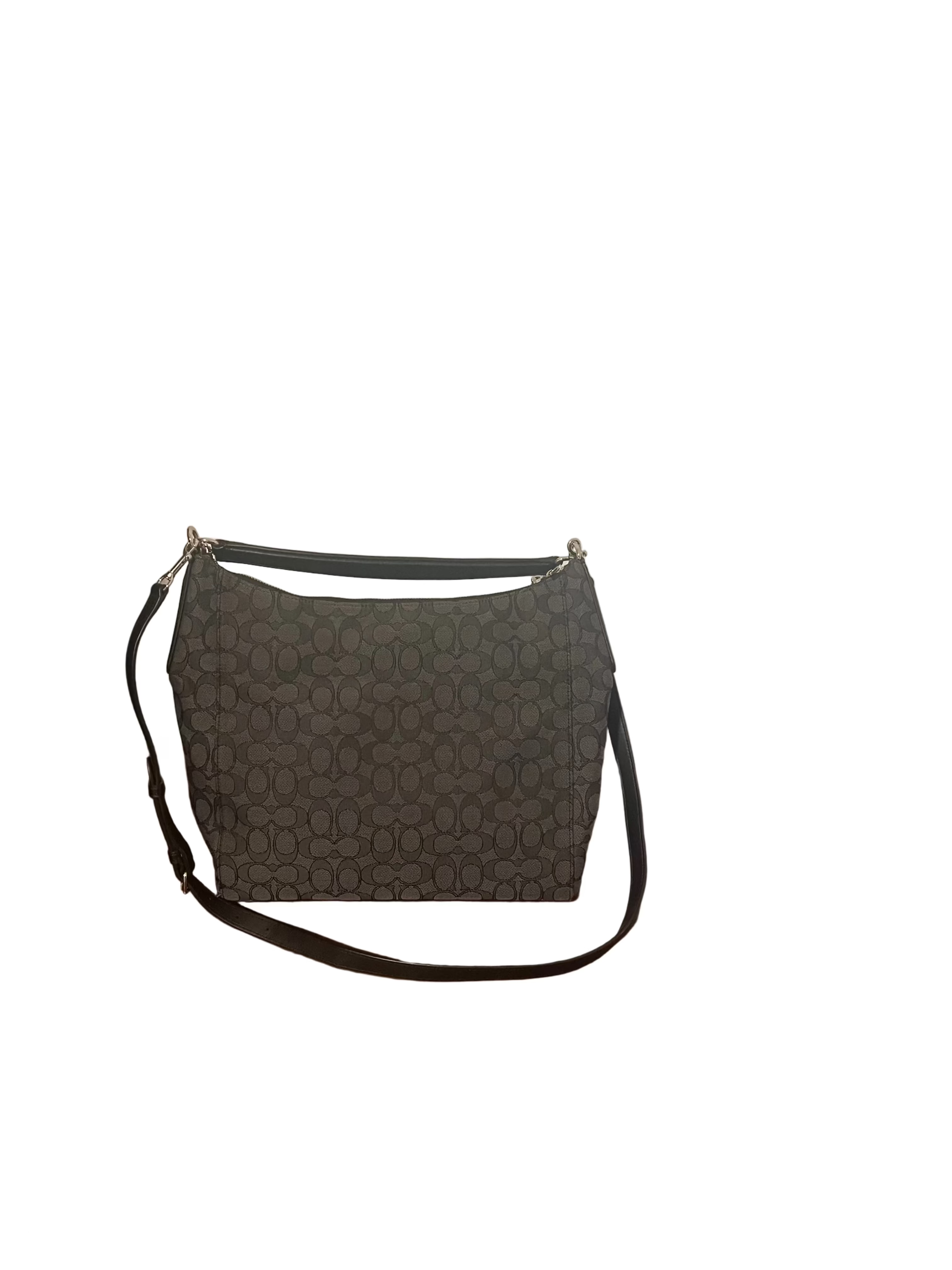 Back side of Coach dark gray monogram shoulder bag with a black leather strap.
